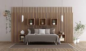 Wood paneling in Gorakhpur bedroom design with vertical wooden fluted wall panels and modern interior decor.