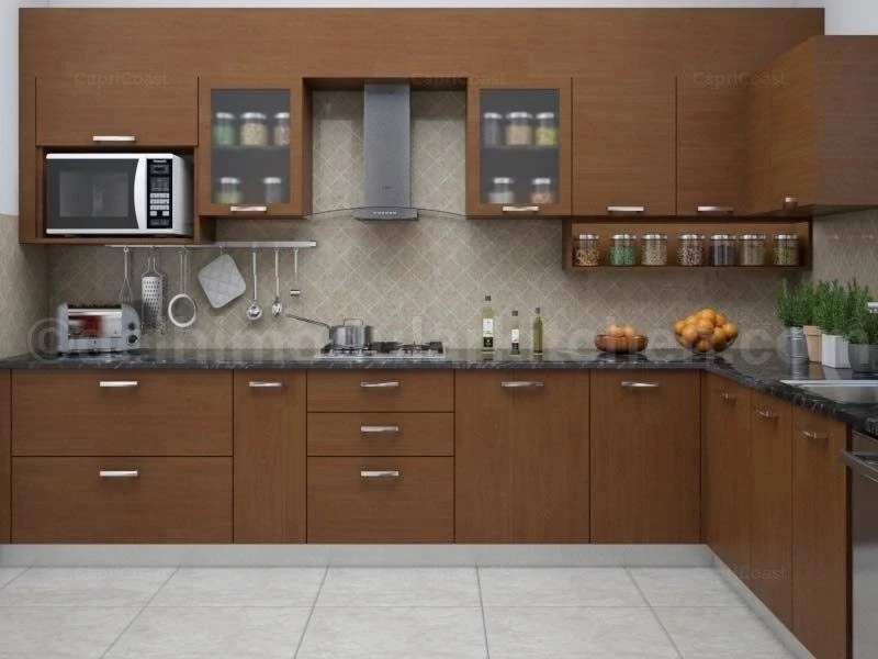 Modern wooden modular kitchen design with cabinets, chimney, and organized storage in Gorakhpur