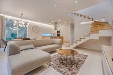 Modern home interior design in Gorakhpur with stylish living room, sofa, and staircase