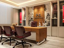 Modern office interior design in Gorakhpur with wooden panel wall, executive desk and conference chairs.